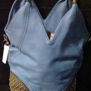 Sky blue saddle bad with brown patches